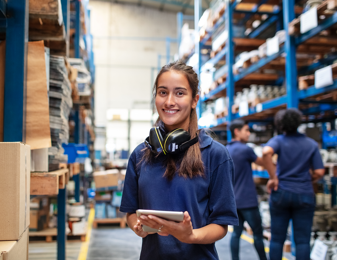 warehouse-worker-holding-tablet-smiling