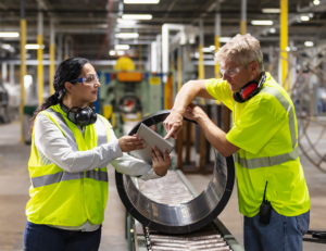 manufacturing-workers-looking-at-tablet