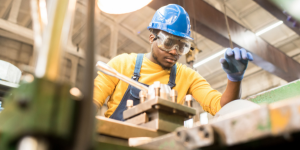 person working with safety glasses and helmet