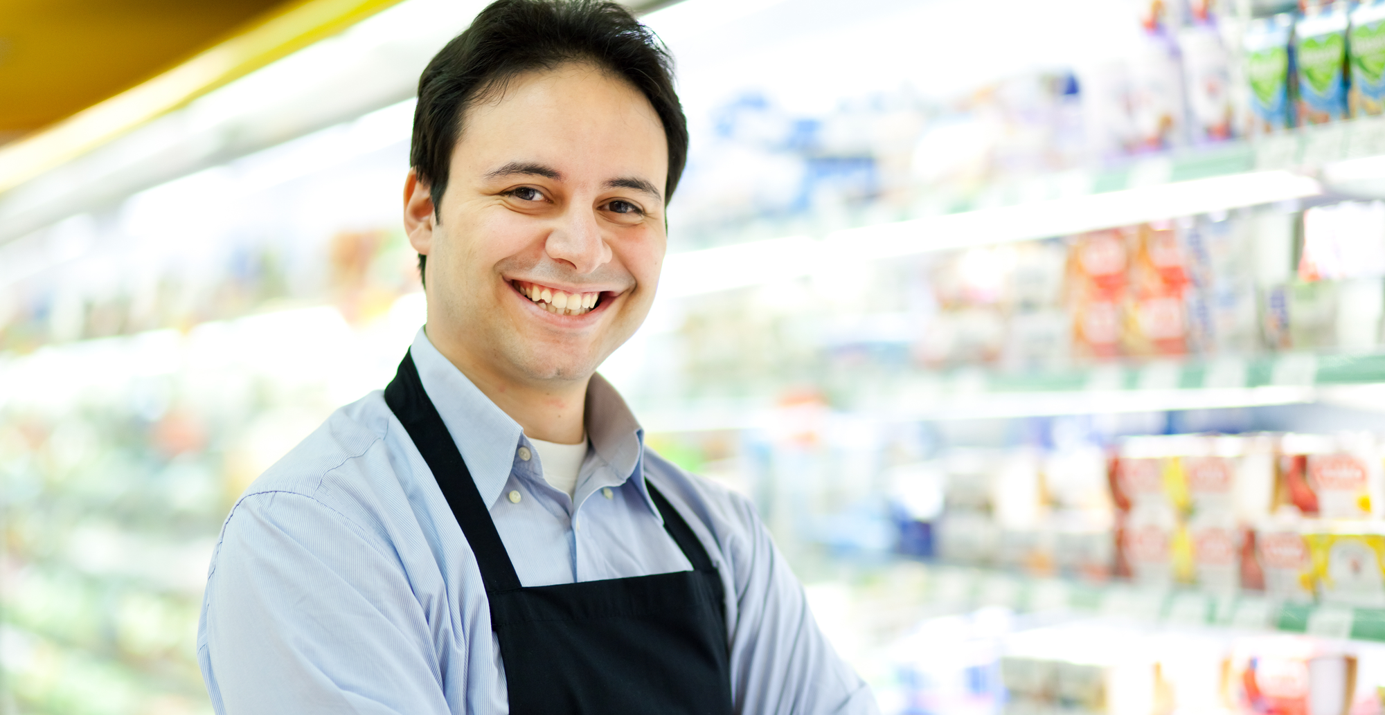 Happy employee at a butcher shop