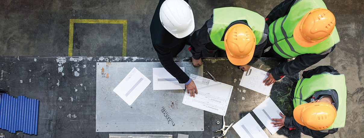 Workers and manager working with documents