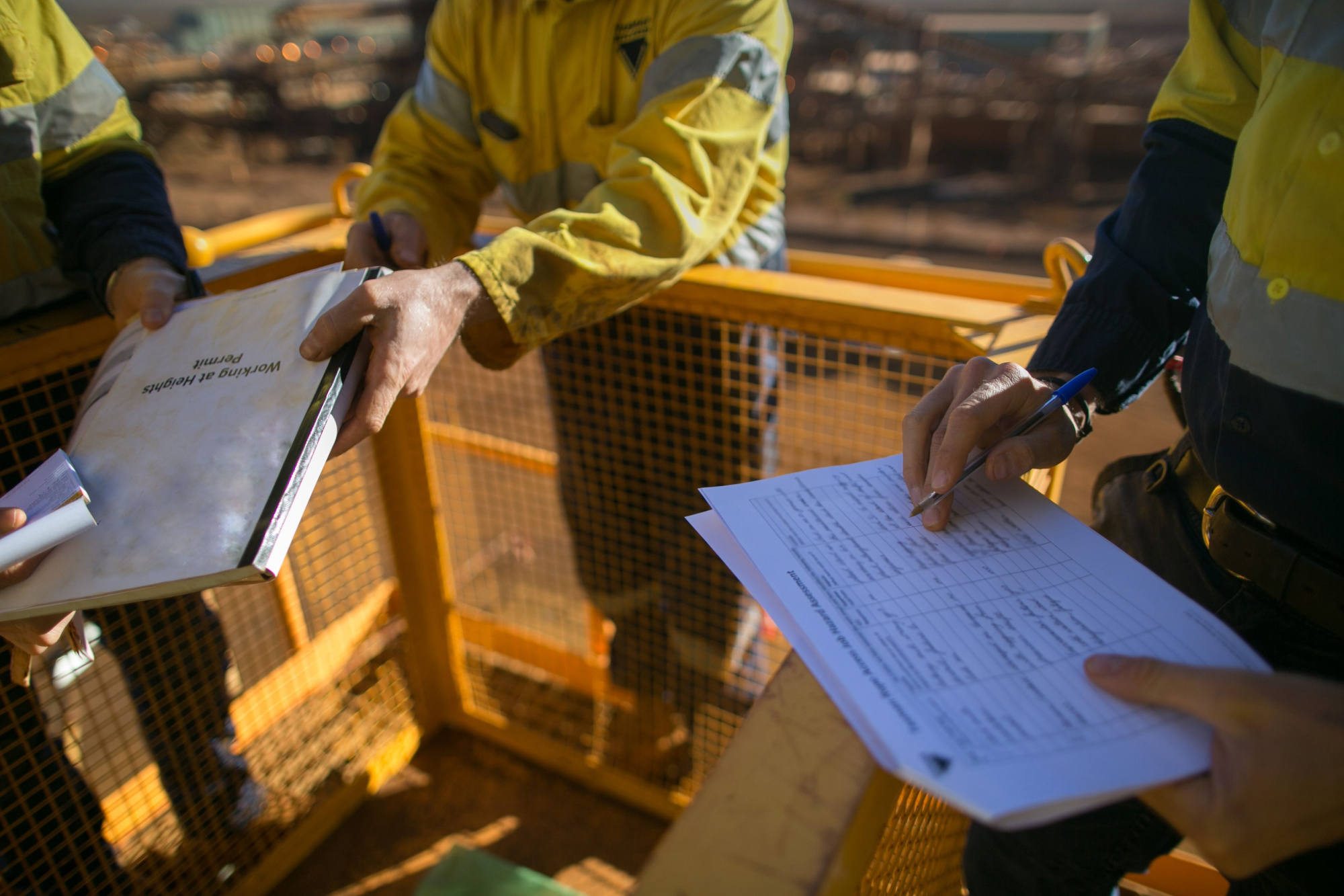 person filling out a job safety analysis