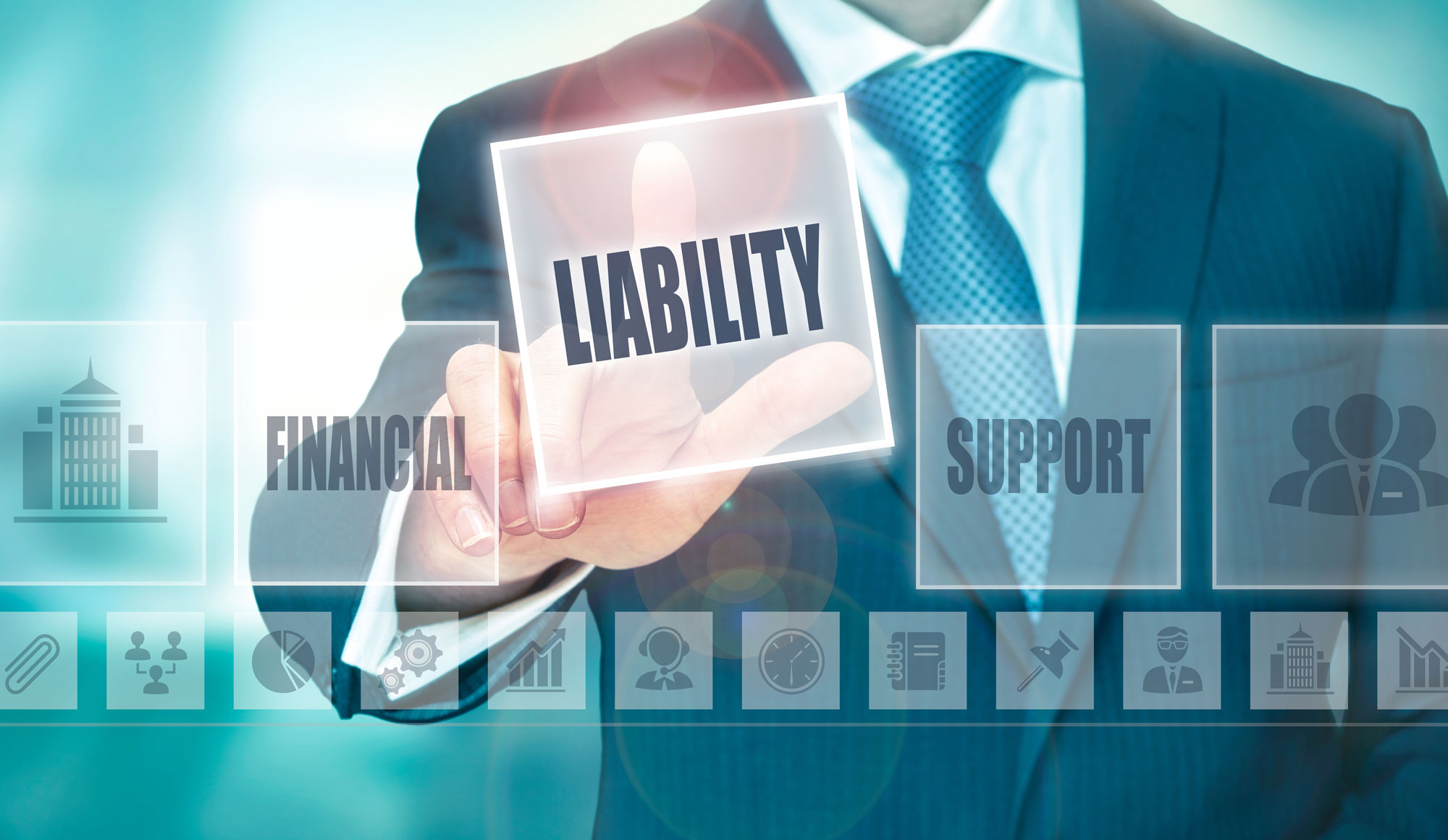 a person pointing to the word liability on the screen