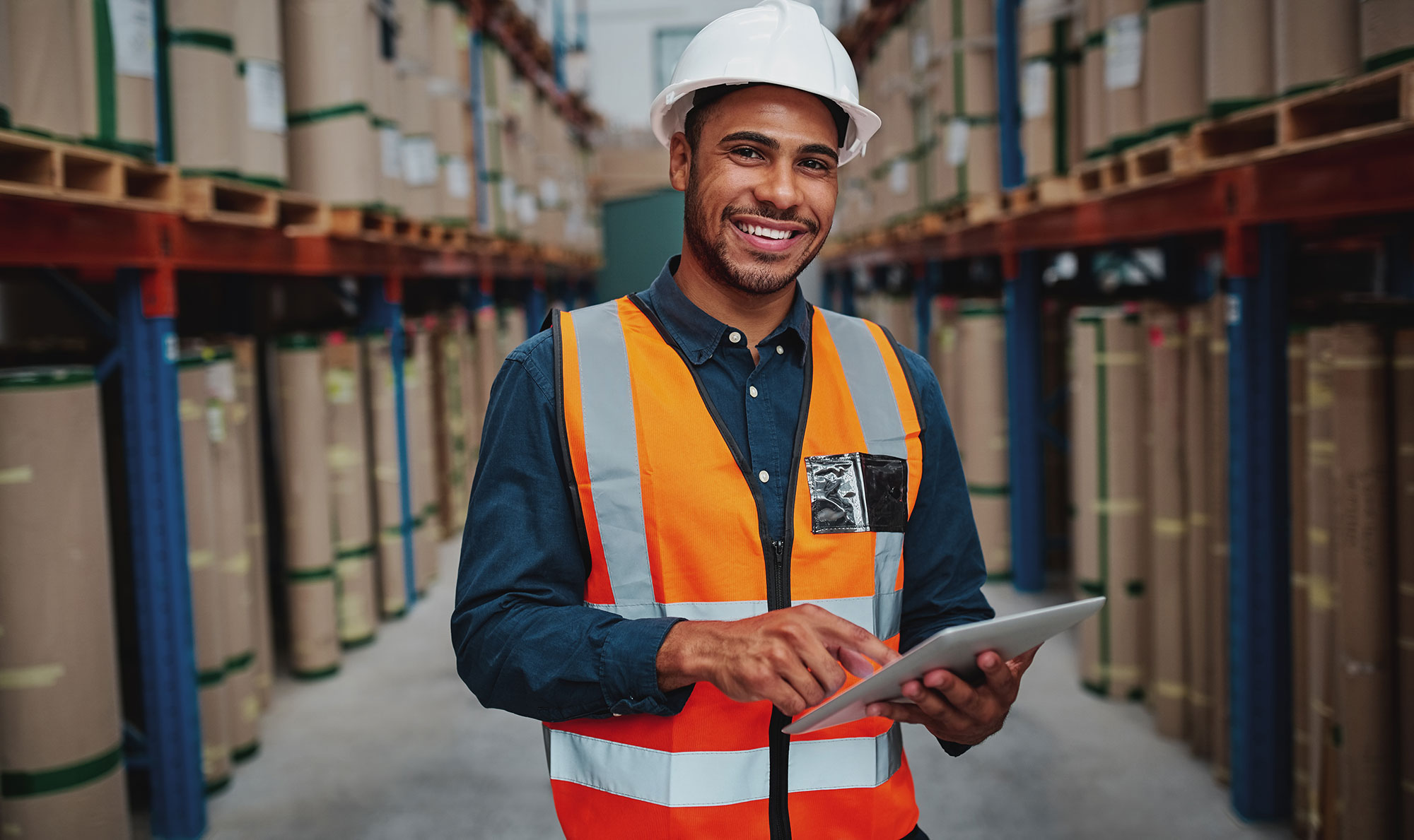 male factory manager using a digital tablet in the warehouse