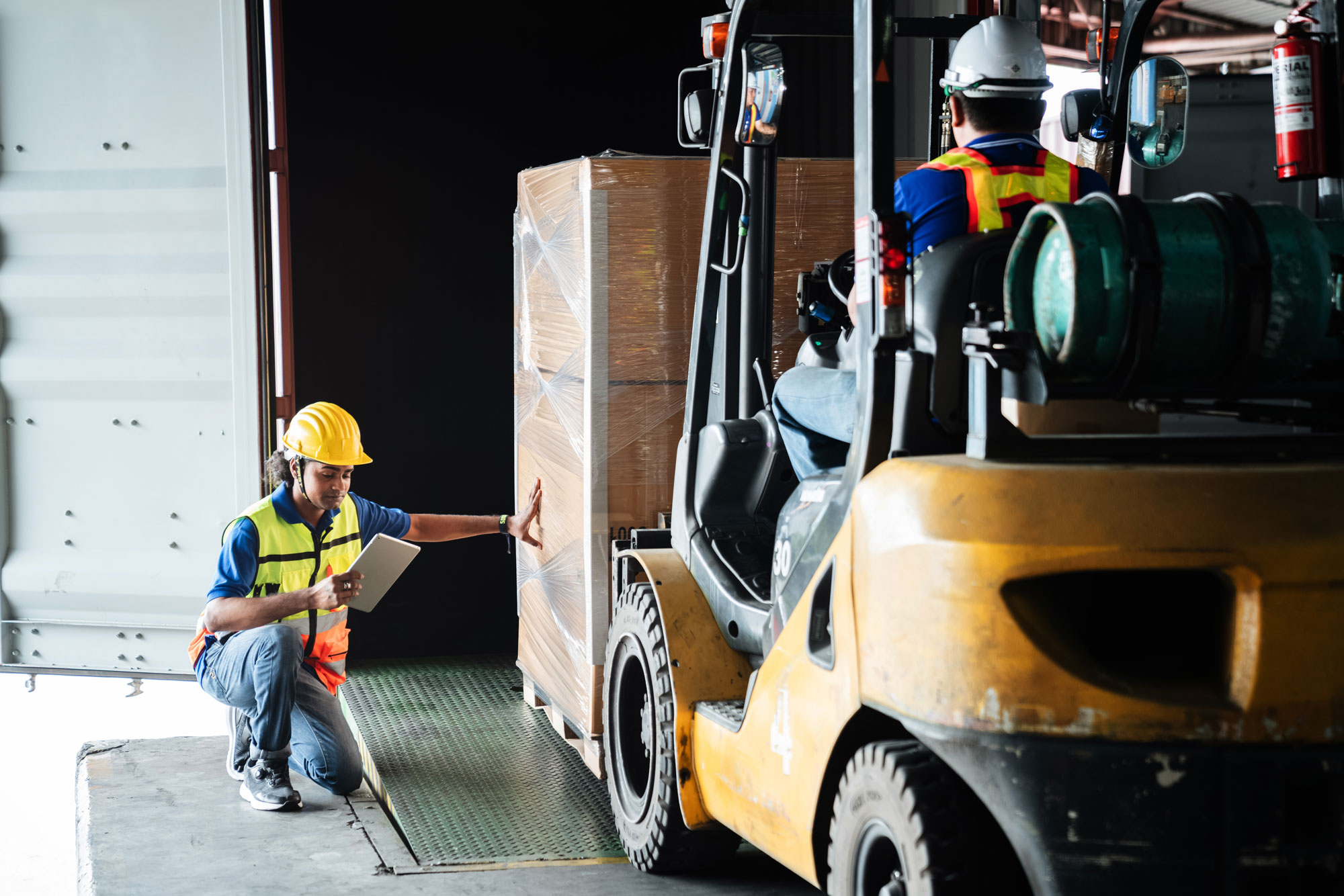 forklift operators in a warehouse