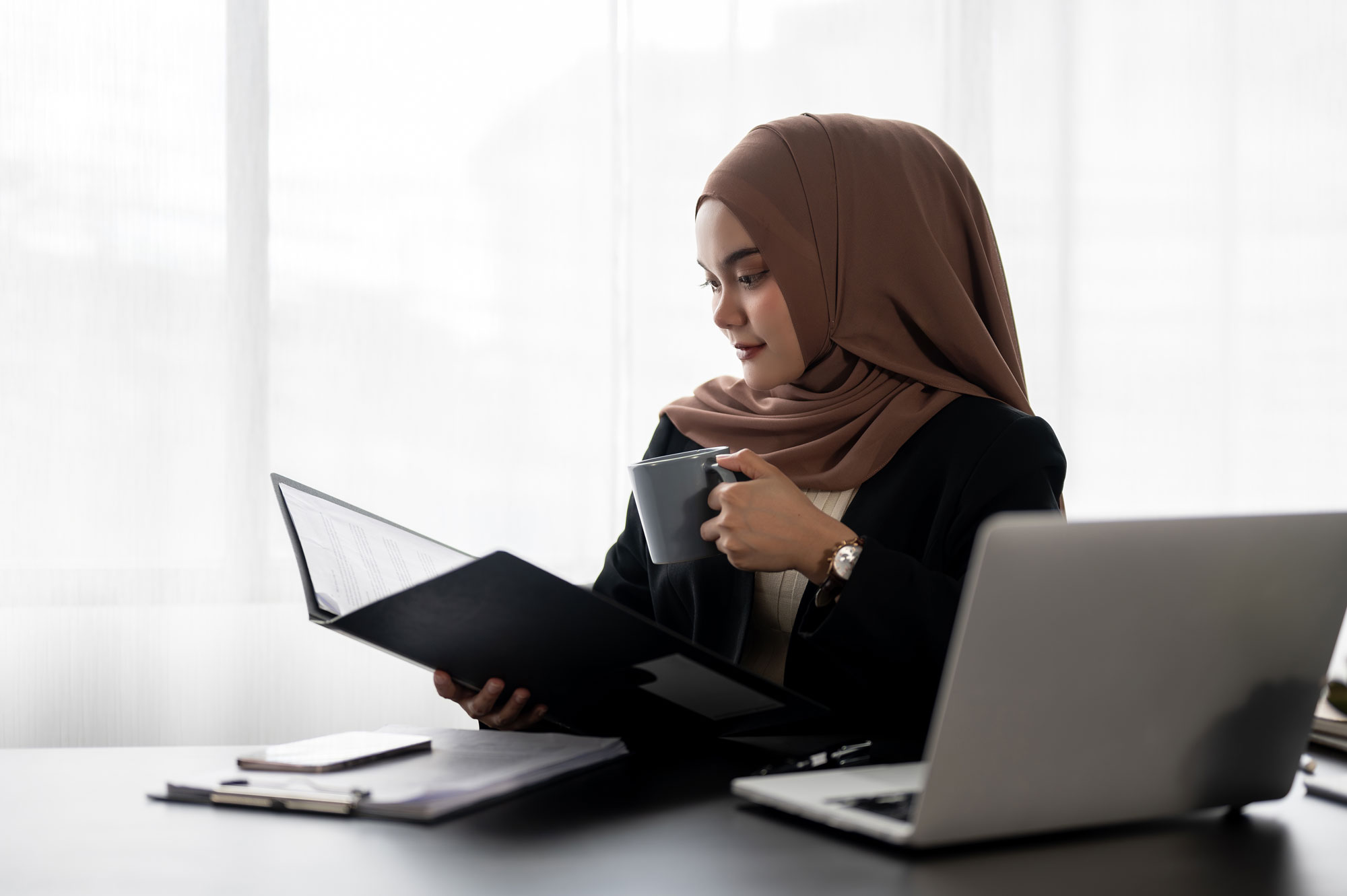 religious woman working behind desk