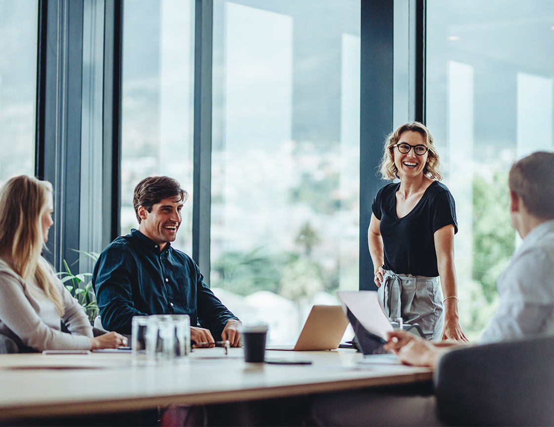 conference-room-woman-standing-talking-to-group