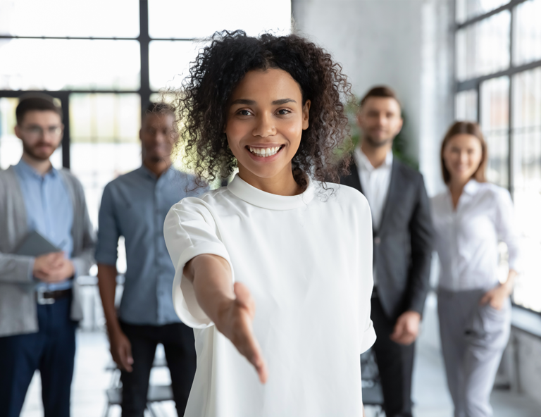 woman-reaching-her-hand-out-and-four-people-standing-behind-her