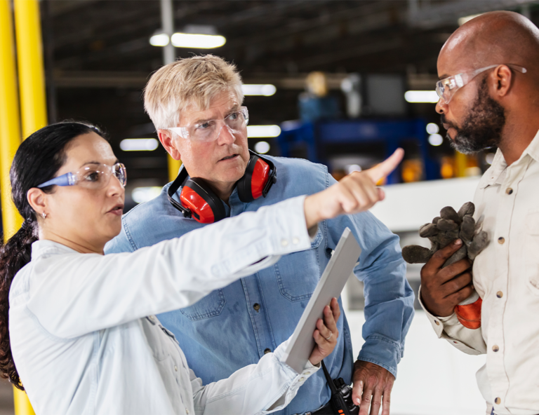 workers-in-protective-gear-pointing