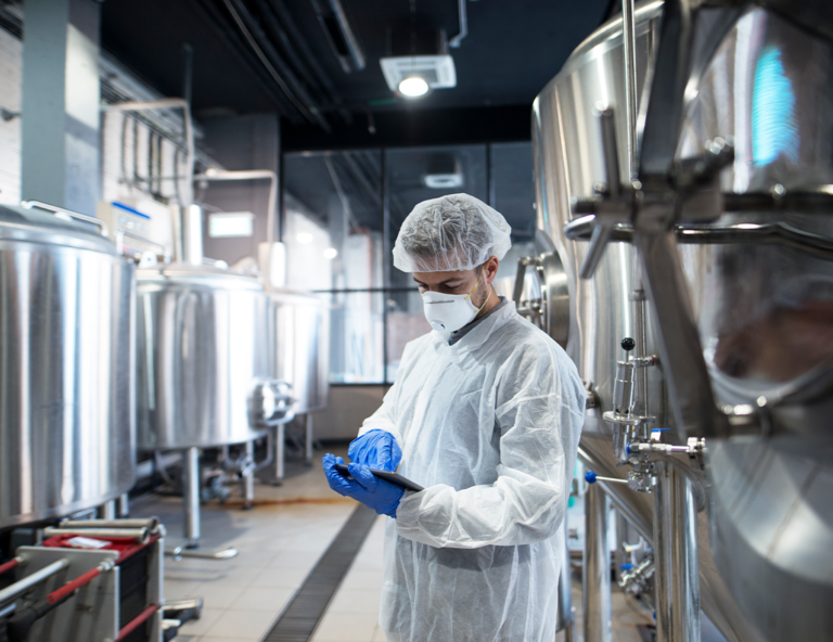 person-in-lab-coat-and-mask