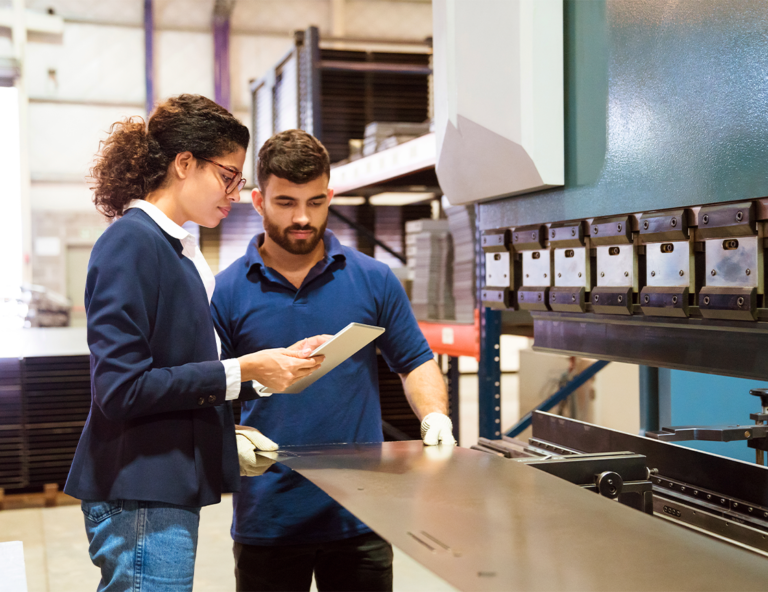 two-factory-workers-using-a-tablet