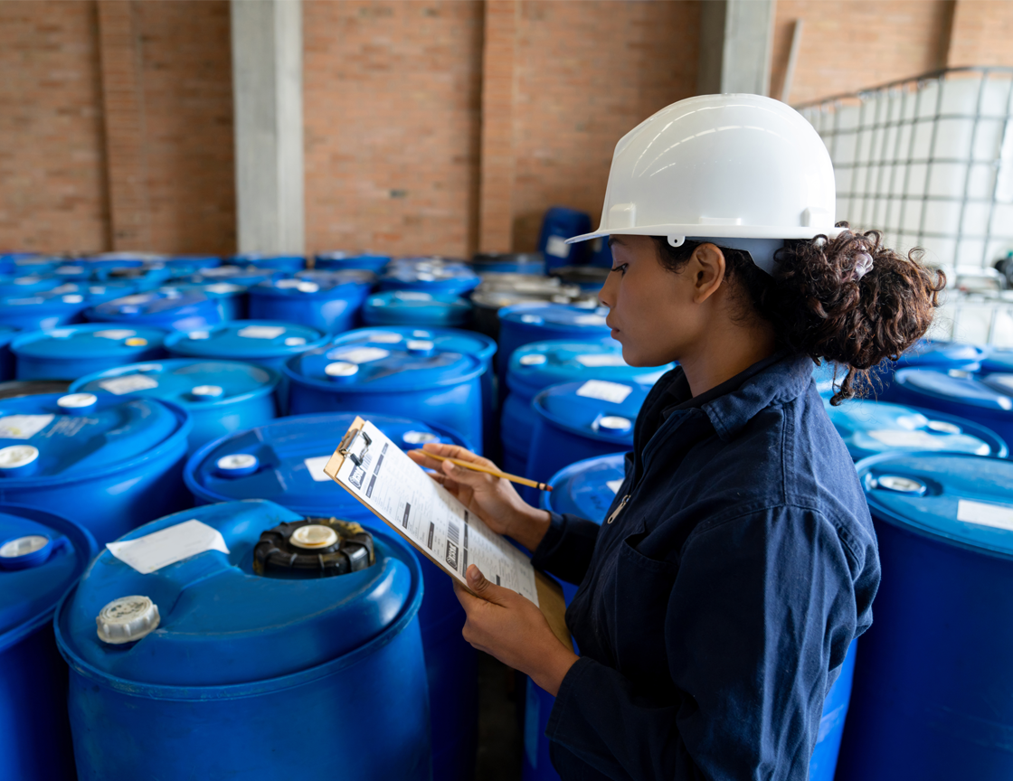 woman-in-hard-hat-looking-at-clipboard