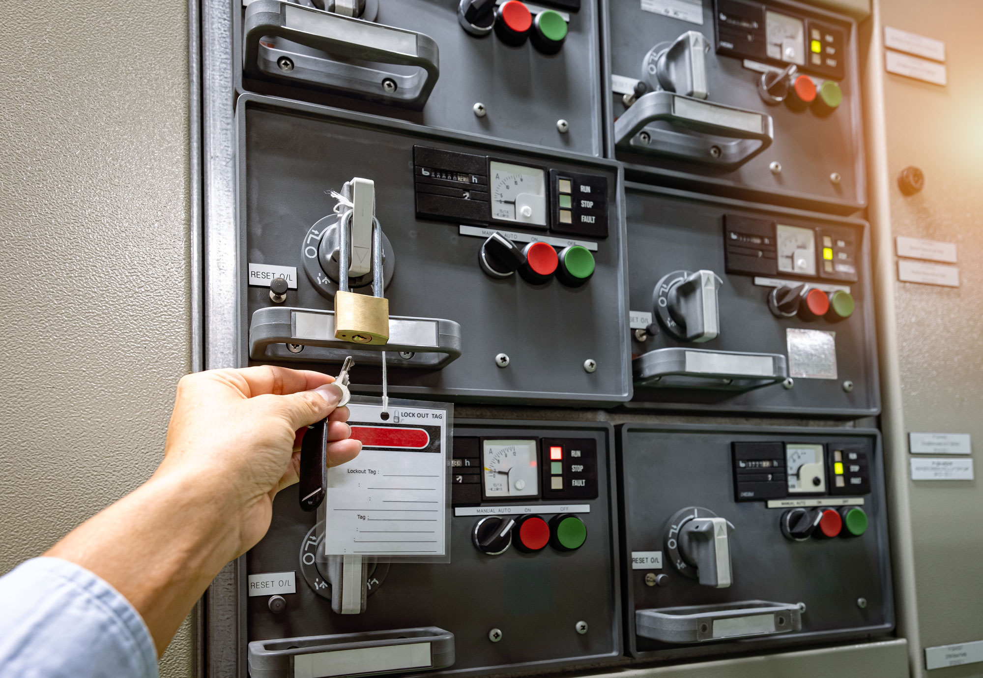 person utilizing lockout tagout system