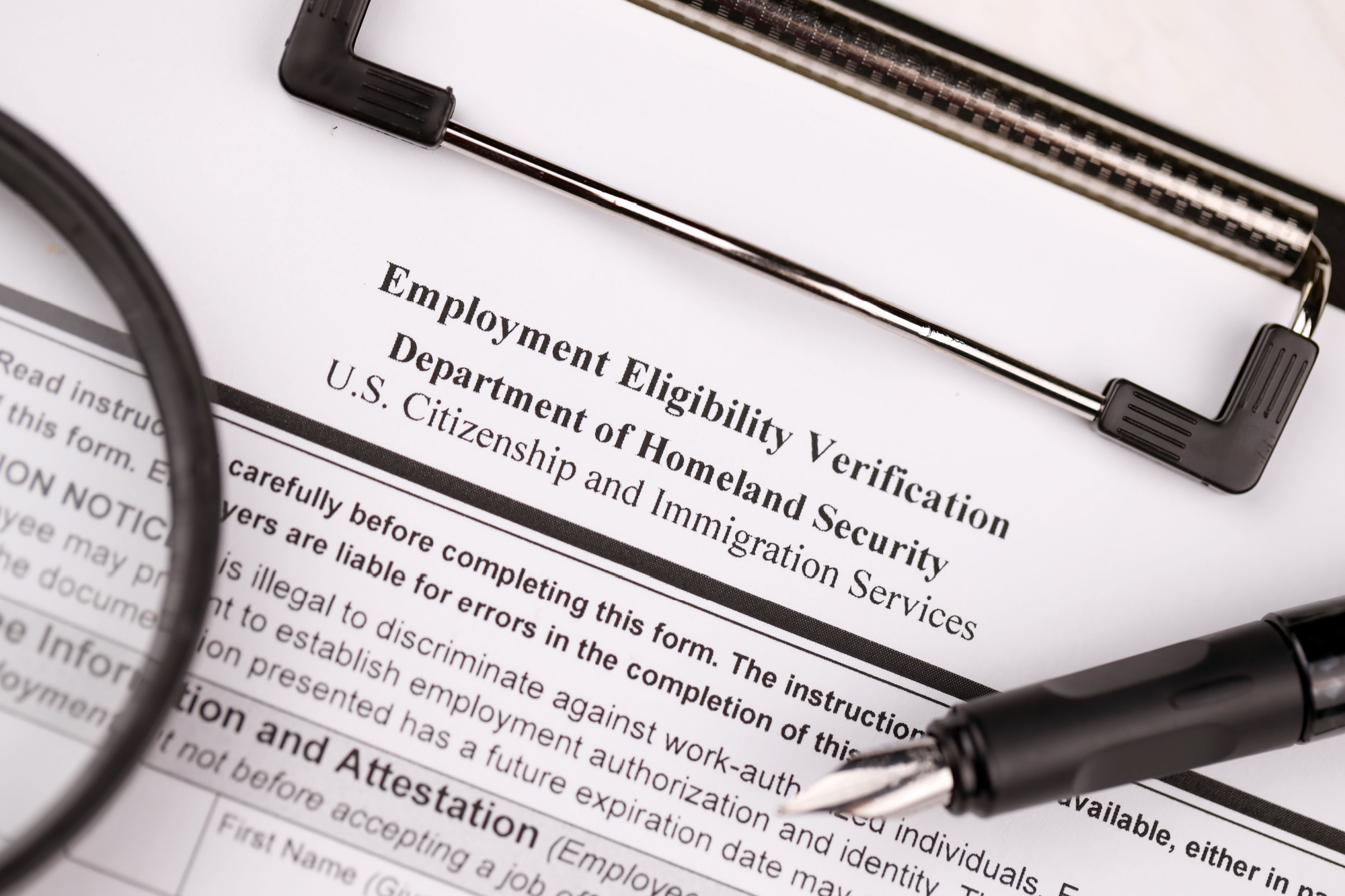 employment eligibility verification form on clipboard