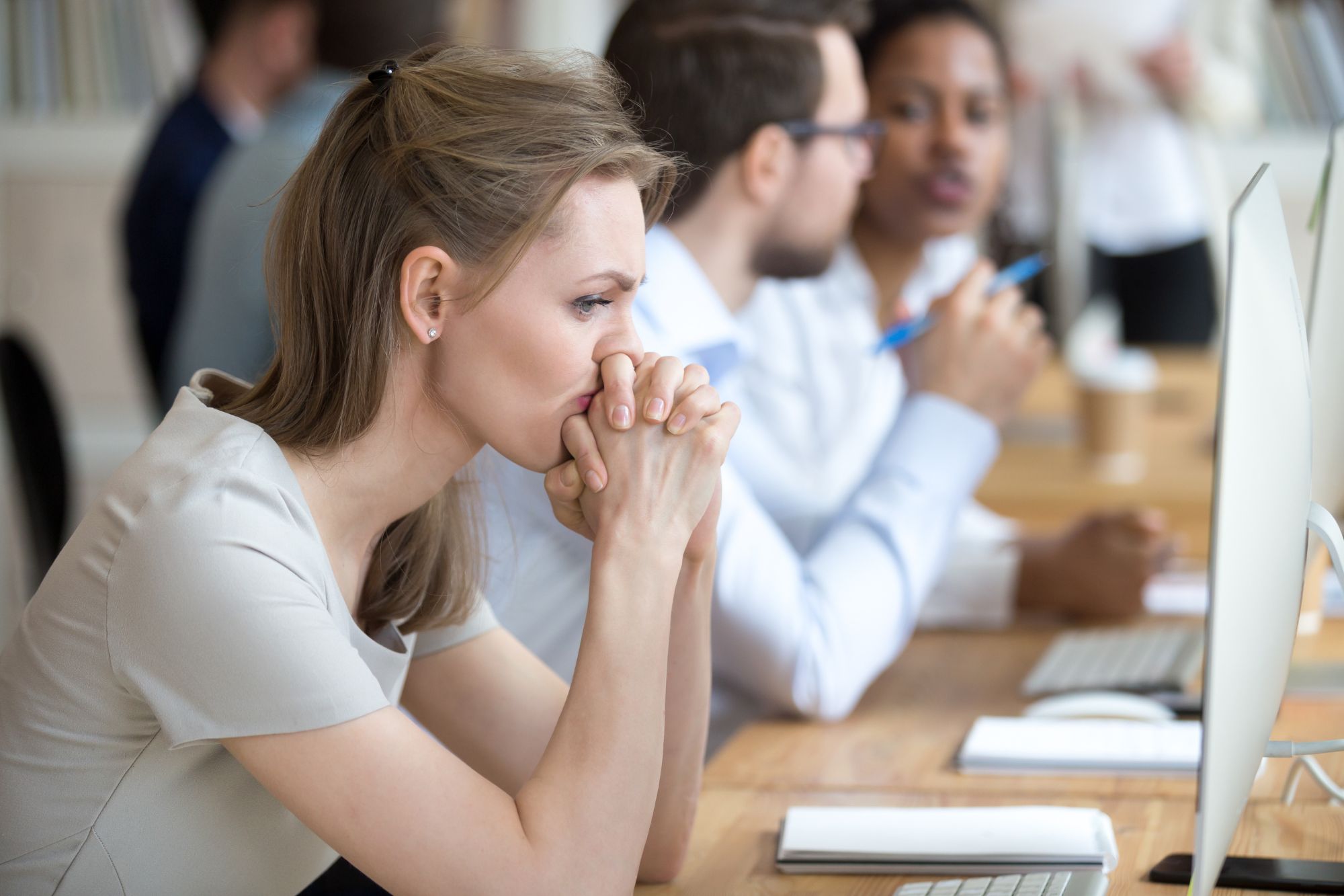 woman looking sad at computer