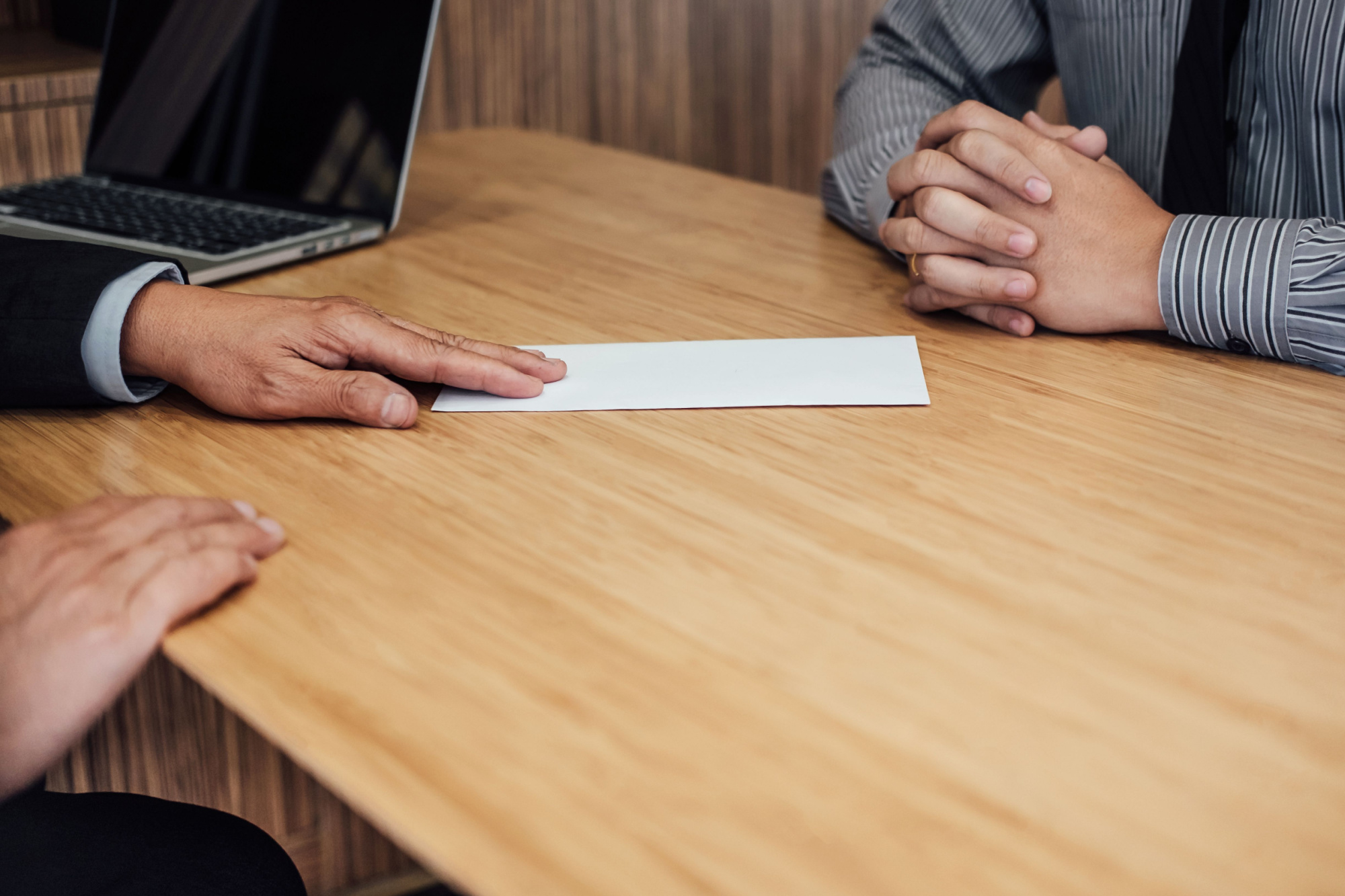 employee handing over an envelope