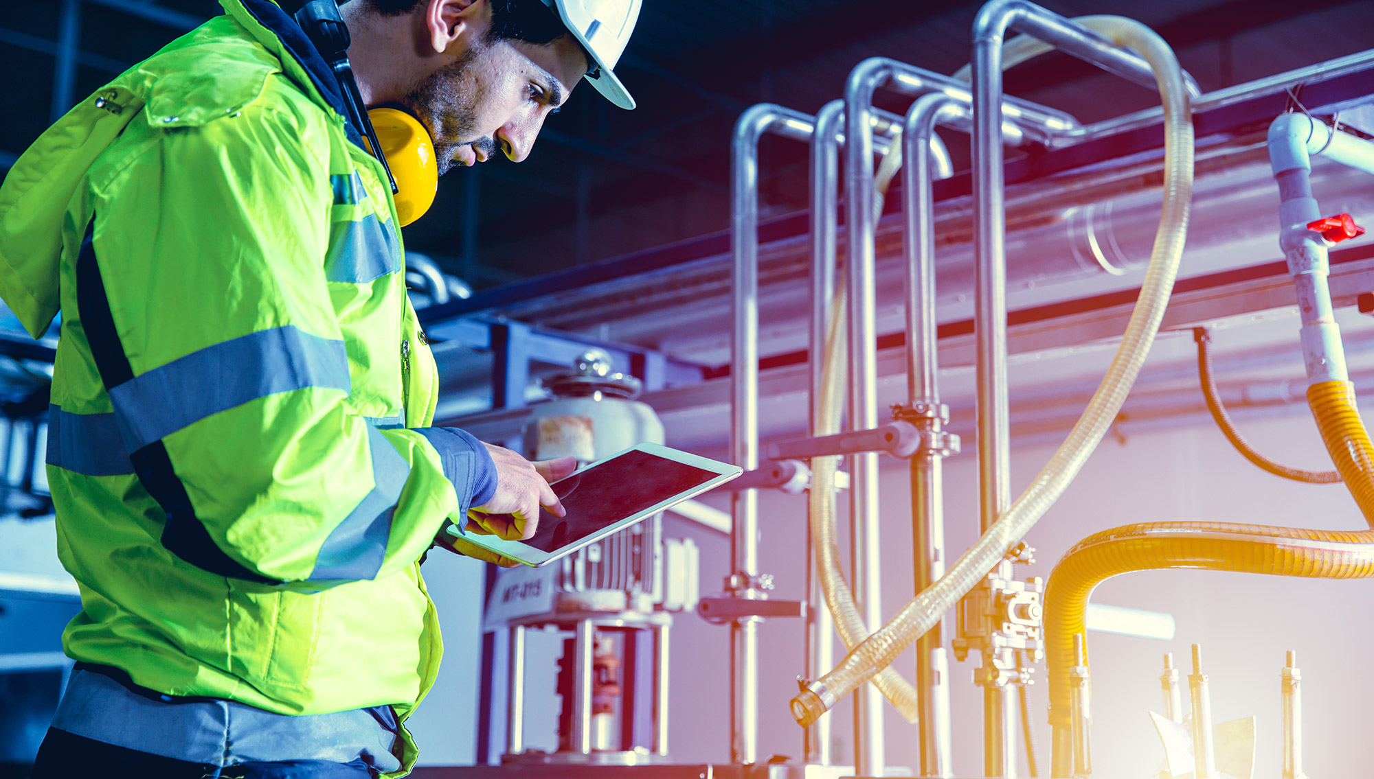 engineer-working-in-factory-using-tablet-to-check-boiler-pipes