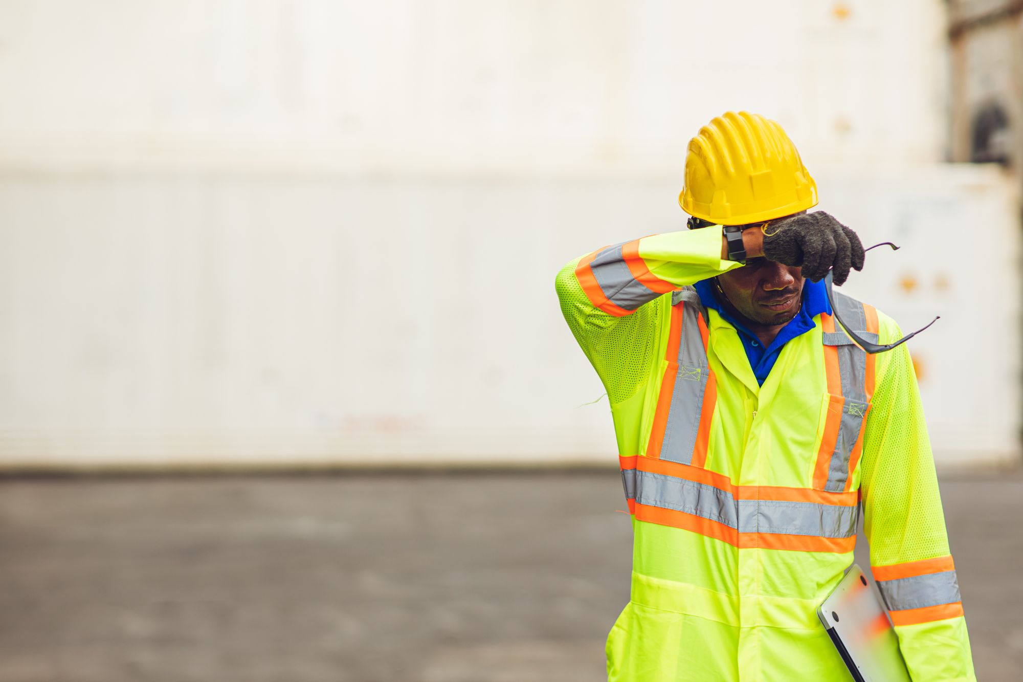 worker in safety gear experiencing heat stress