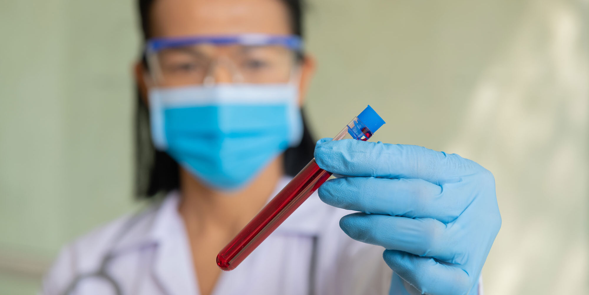 Healthcare worker holding a test tube