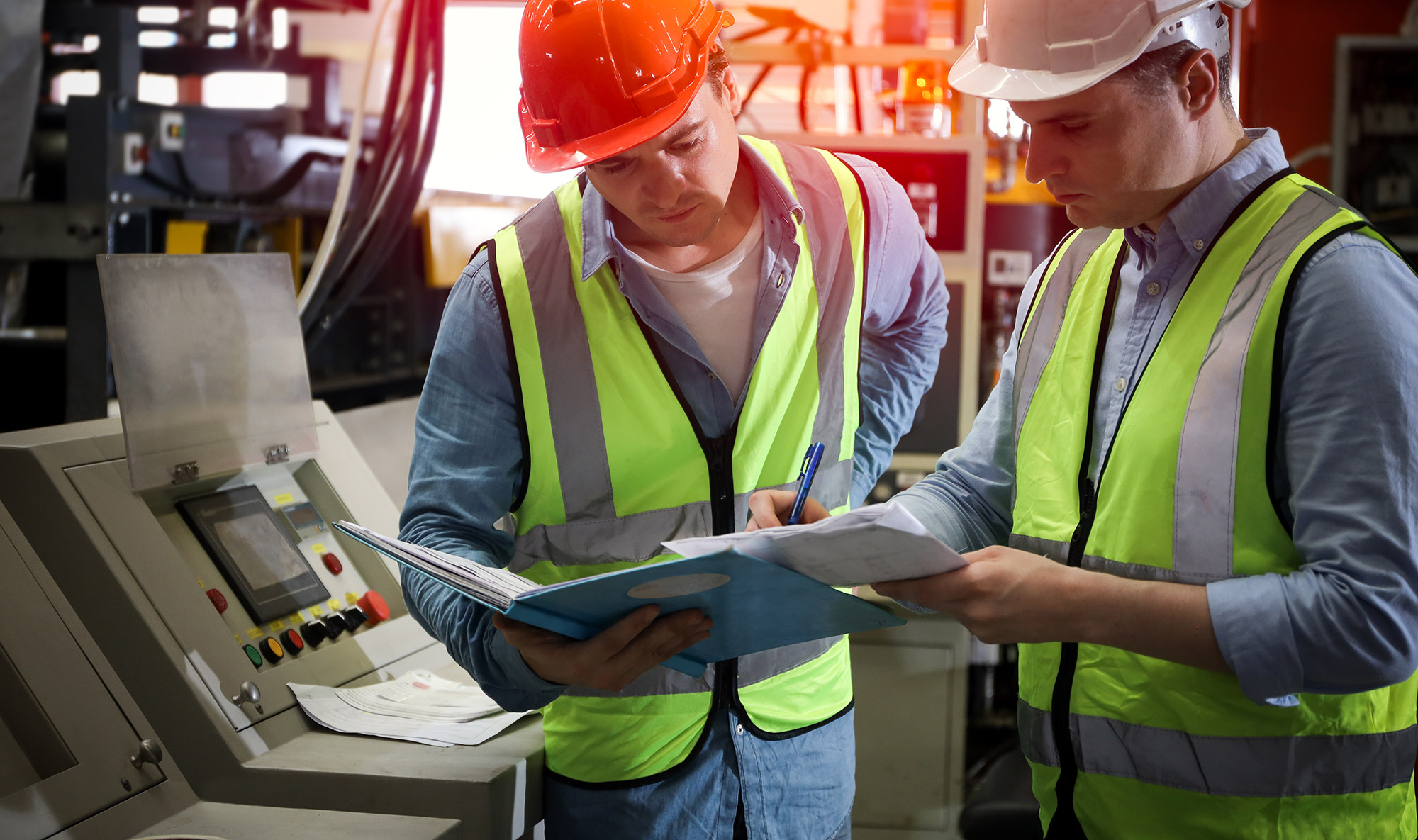 Engineer-and-technician-discussing-production-line-process-safety