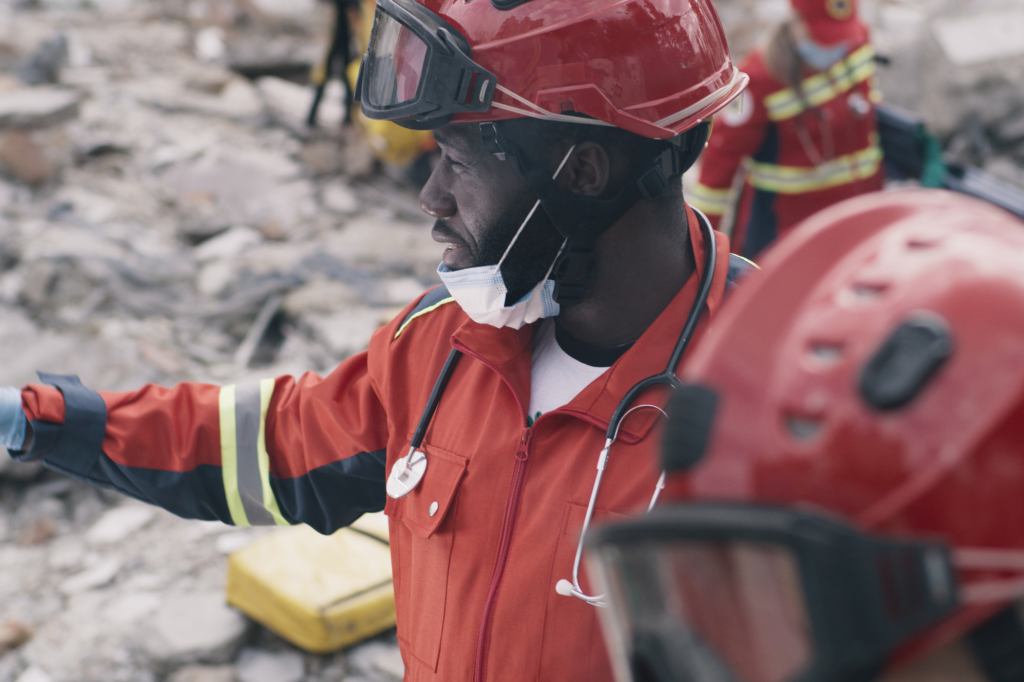 rescue workers in safety gear performing a clean up