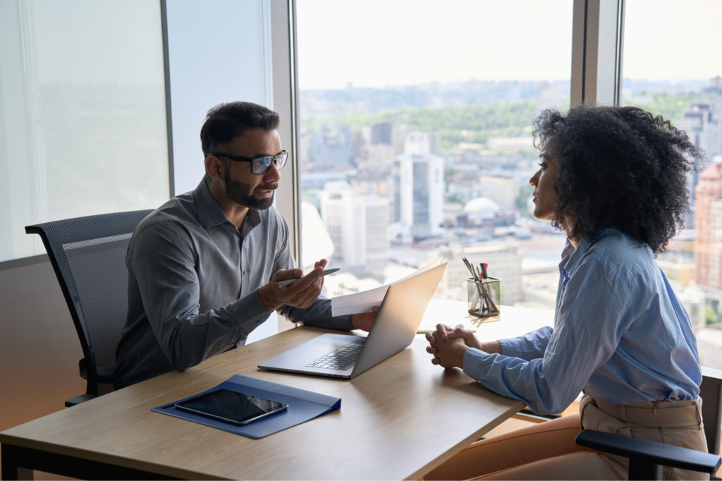 man and woman having an interview