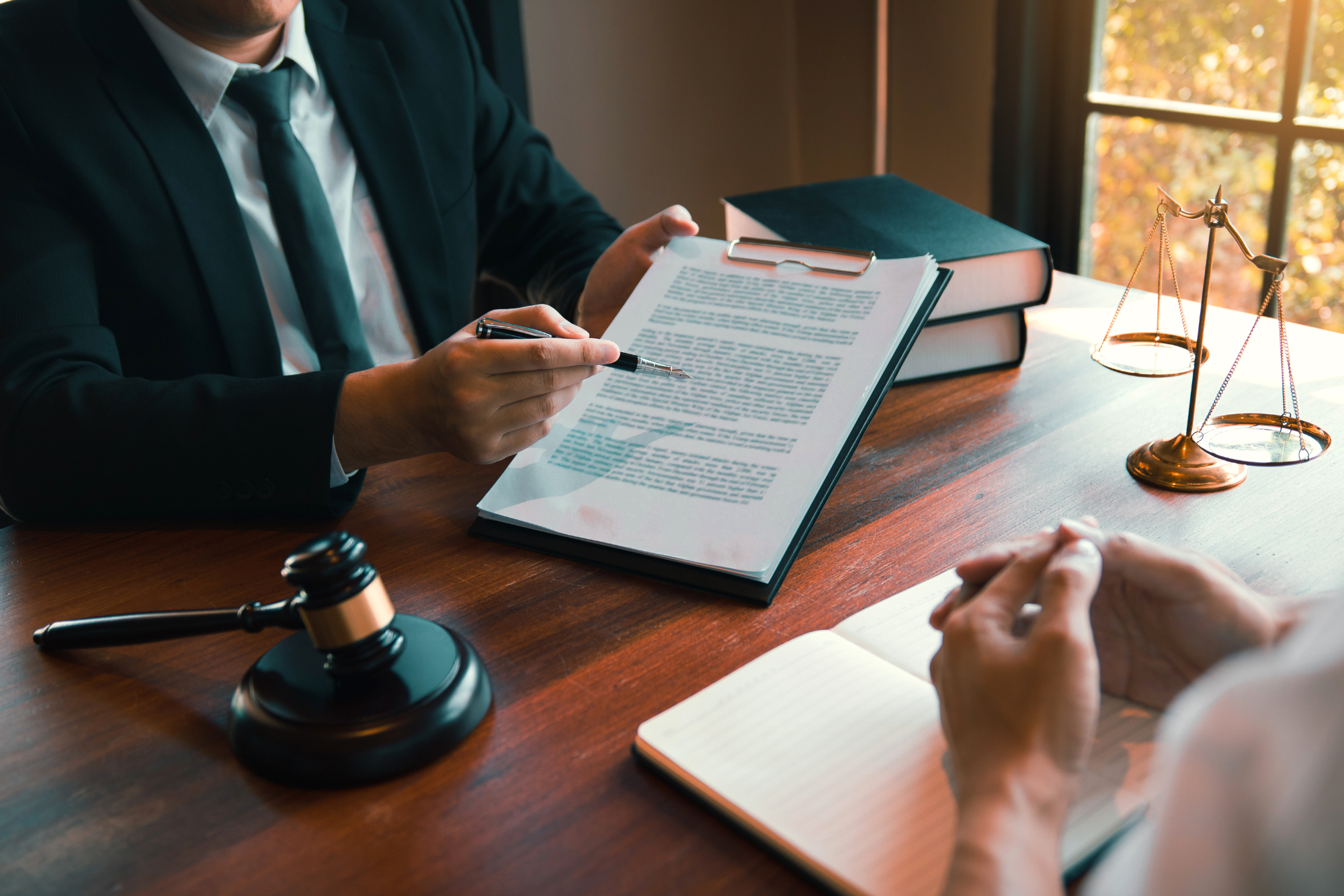 two people reviewing a legal document