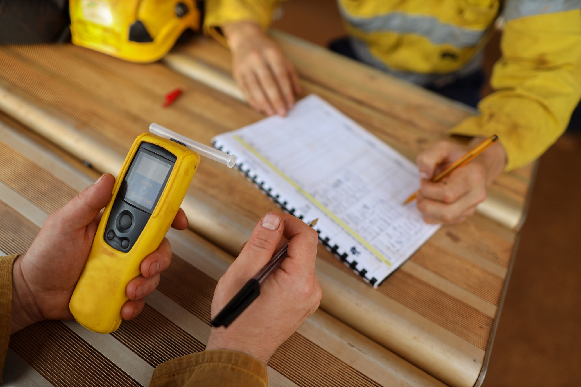 worker completing a breathalyzer and drug screening