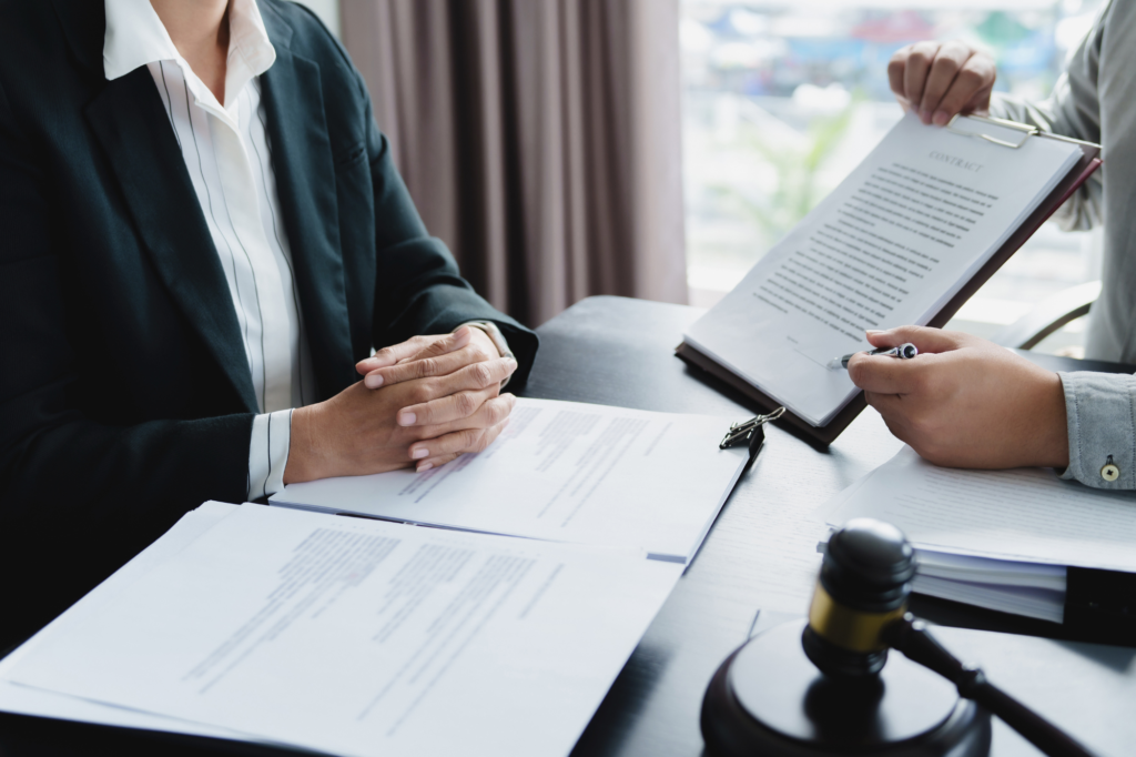 two people reviewing legal documents