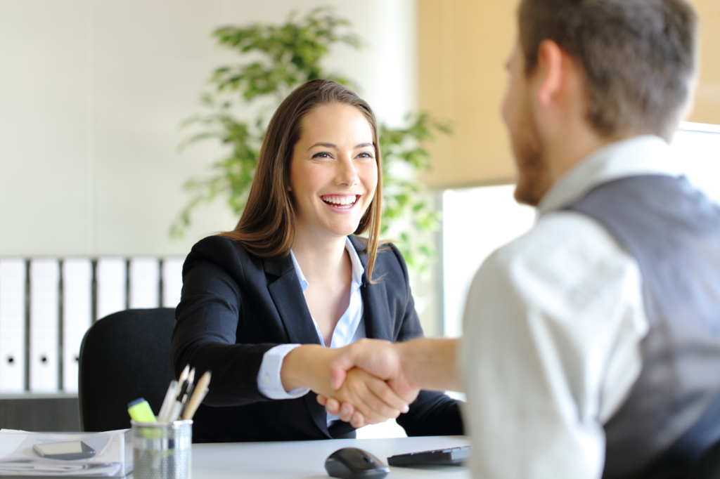 interviewer and interviewee shaking hands