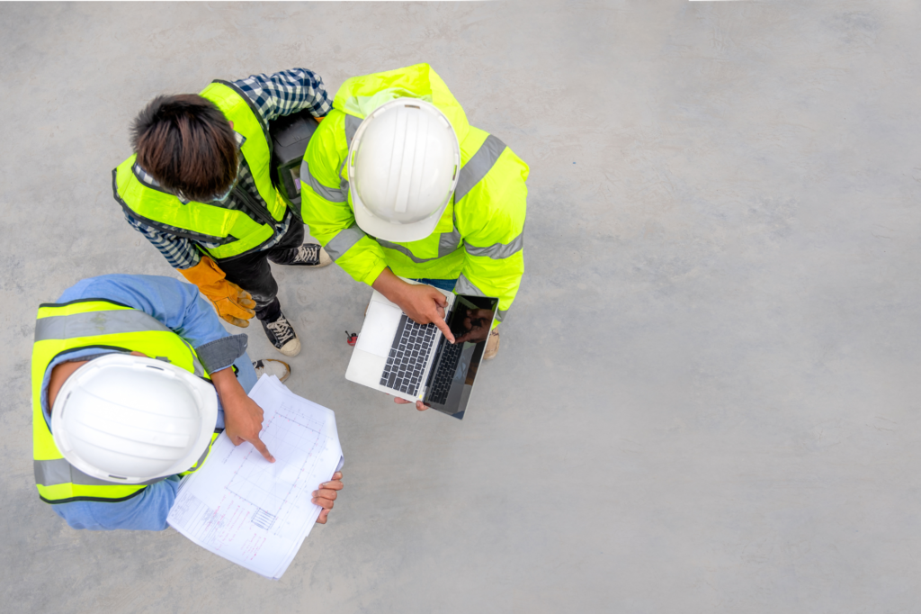 group of three safety workers performing an audit