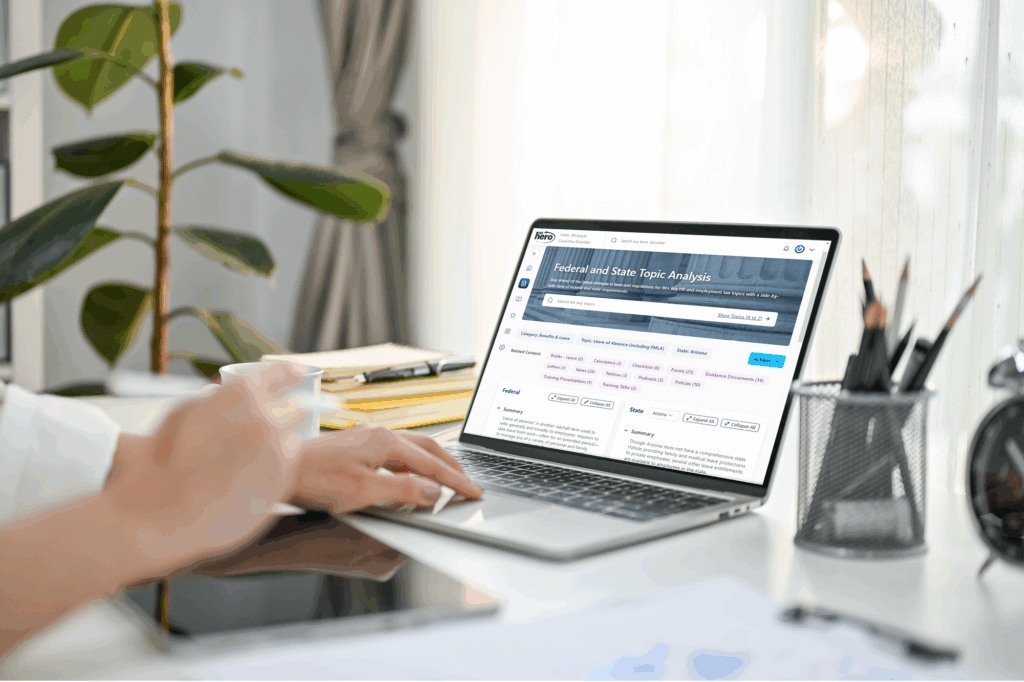 worker at a desk looking at the federal and state topic analysis