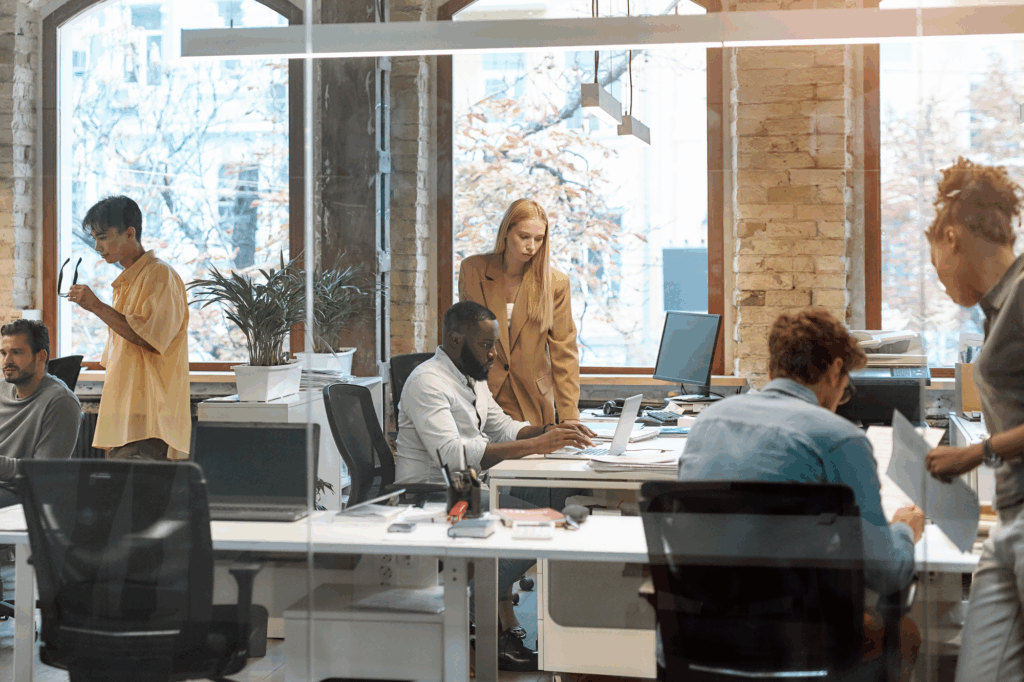Working together on project. Group of young mixed race business people working together in the creative office.