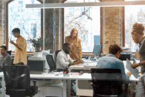 Working together on project. Group of young mixed race business people working together in the creative office.