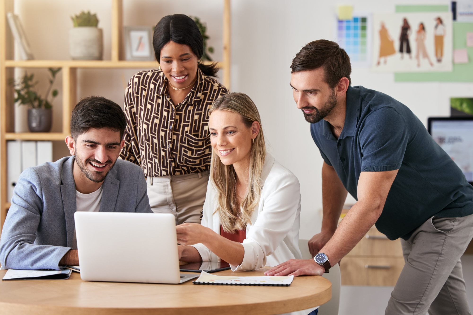 Sales, strategy and business people in a meeting about digital marketing, vision and advertising idea on laptop