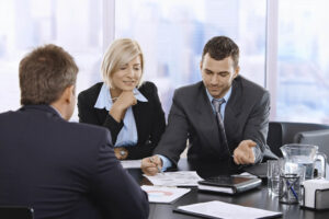 business colleagues review documents and papers